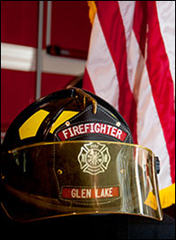 glen lake firefighter helmet up close - American flag in background