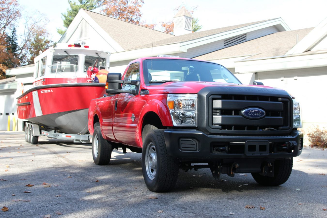 utility 381 truck pulling fire rescue boat